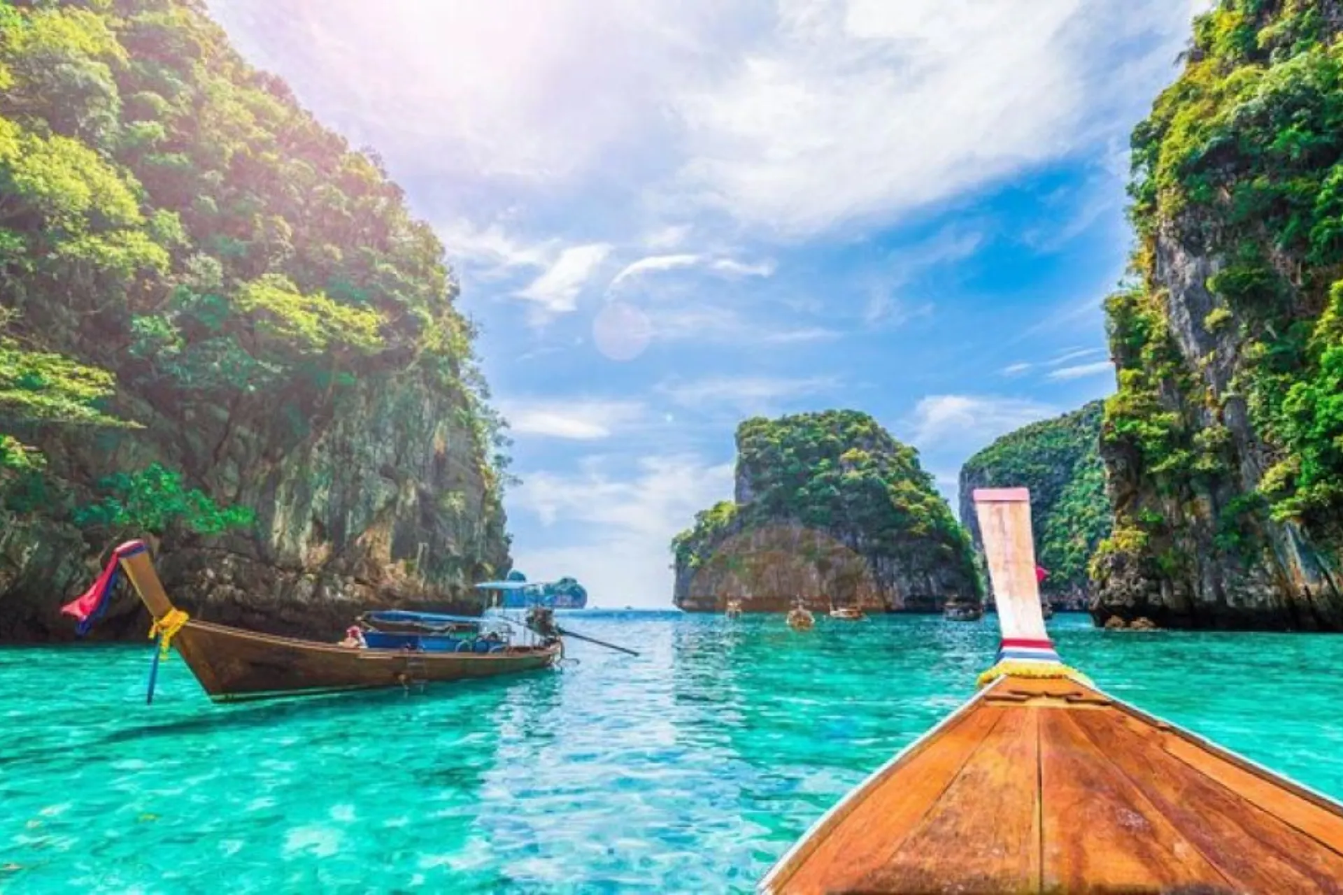 Long-tail boat on clear blue water at Phi Phi Don